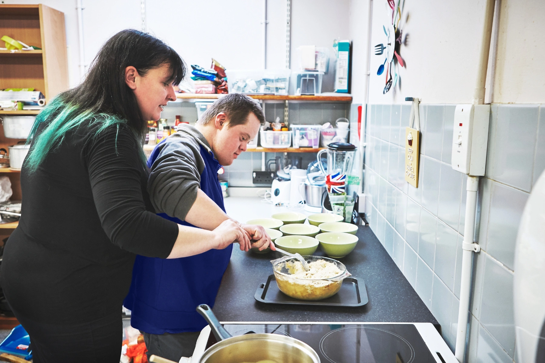 Shared Living Cooking andm Plating with Down Syndrome Guy
